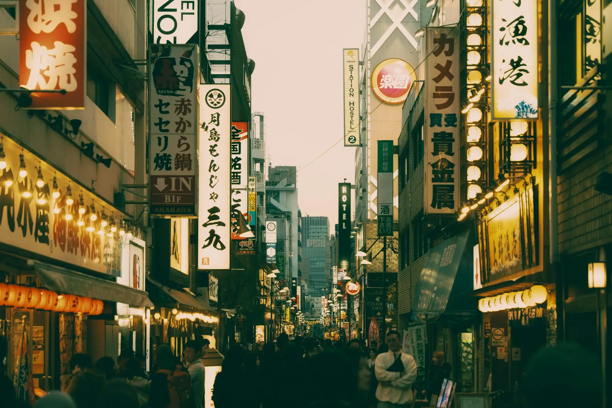 Japanese-language signage lining a narrow Tokyo street